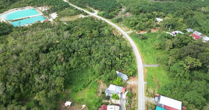 Aerial Drone Footage Of Pugu Fishing Village,Background Green Mount Gading Lundu And Open Sea With White Sandy Beach,That Connected To Sematan Town,Borneo,Malaysia