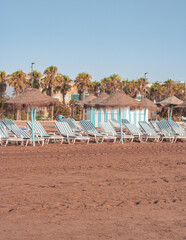 beach with umbrellas and chairs