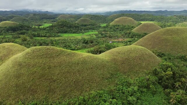 Aerial around view of Chocolate hills - geological formation on Bohol island, Philippines, 4k