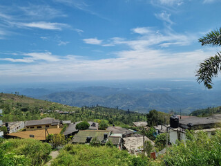 Hilly landscape of Sri Lanka dotted with villages and tea plantations near Haputale