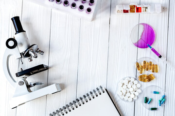 workplace lab assistant with microscope at the clinic top view