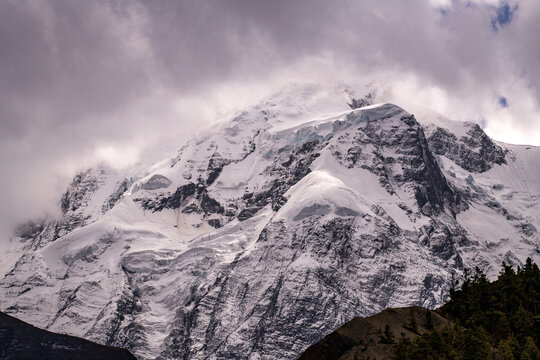 Gangapurna (7,455 meters) and the Gangapurna Glacier rising above the Manang Valley, photographed shortly before reaching Manang on the Annapurna Circuit in Nepal. Dramatic Himalayan mountain landscap