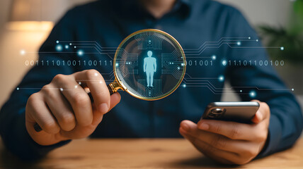 Magnifying glass over a silhouette of a person on a digital network interface, symbolizing data analysis and human resource search.
