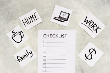 Checklist and many paper cards with hand drawing of different life activities, top view. Life balance and planning concept.