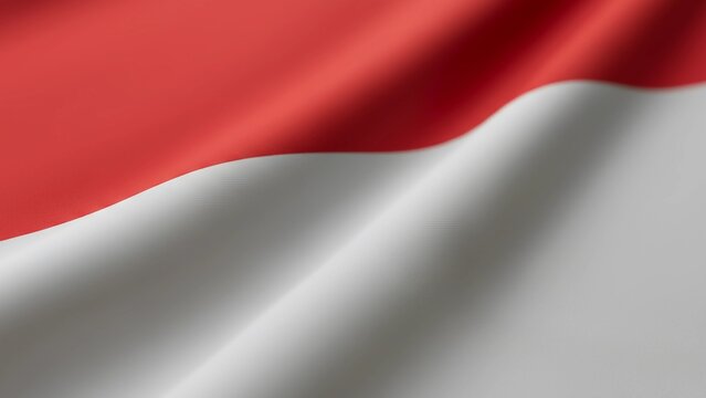 Close-up image of the Indonesian national flag with its red and white horizontal bands showing smooth fabric texture and soft waving movement - Powered by Adobe