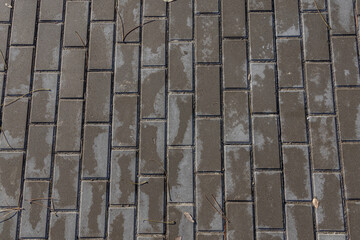 Paving slabs for paths. Paving slabs made of cement mix. Paving stones made of artificial materials. Laying tiles on the road. Material for covering sidewalks and streets. Repair of sidewalks