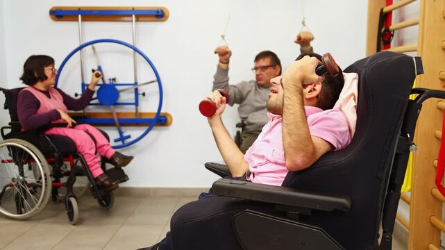 Disabled people exercising together in a physiotherapy gym