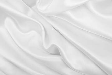 Fototapeta premium Smooth elegant white silk or satin luxury cloth texture as wedding background. Luxurious background design