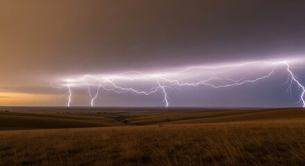 Multiple lightning bolts illuminate a dark, stormy sky over a wide, open field at night, showcasing the raw power of nature.