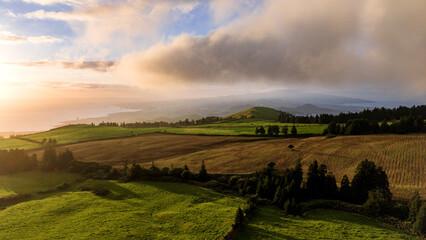 Sunset over green pastures, Azores islands, drone view. © Ayla Harbich