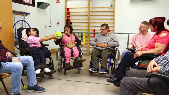 Group of people with disabilities playing ball in a rehabilitation center