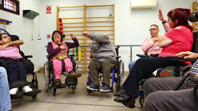 Disabled people exercising together in a rehabilitation gym