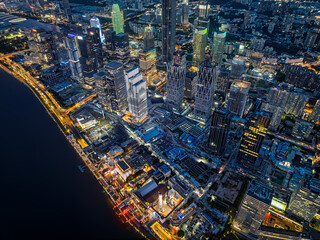 Fototapeta premium Aerial view of the modern city skyline and illuminated skyscrapers at night in Guangzhou, China.