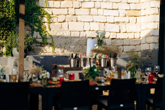 Outdoor feast station with floral and rustic decorative accents