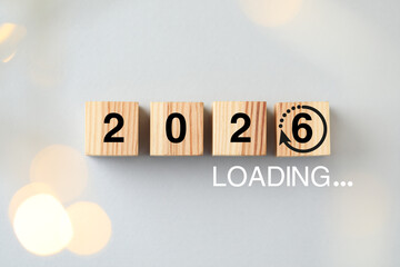 New Year loading. Wooden cubes with numbers on light grey background, top view