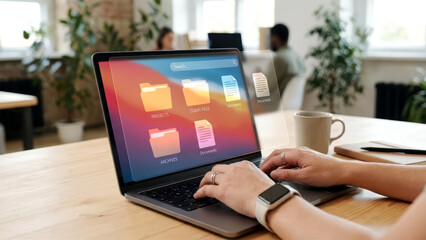 Person Typing on Laptop with Advanced Digital File Management Interface