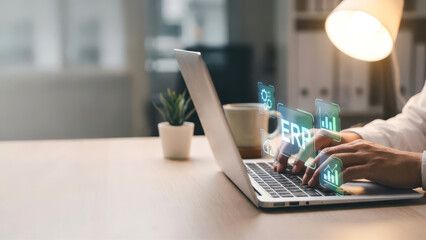 Businessperson Using Laptop for ERP System Management and Data Analytics
