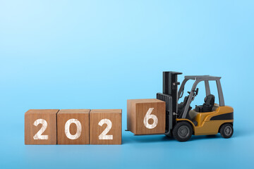 2026 happy new year background. forklift carrying box to complete 2026 text, new year concept © Marsyago