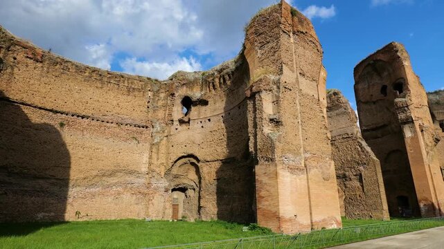 under cloudy sky large scale ruins baths caracalla rome towering reddish brown brick walls prominent arched structure reveal of italy emperor large-scale 