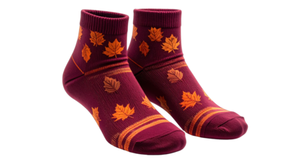 A pair of fall-themed socks, burgundy with orange leaves, isolated on black