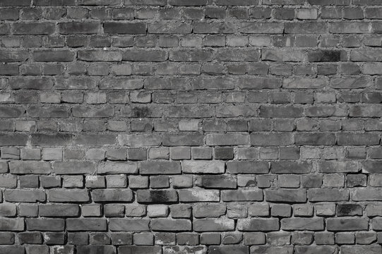 gray background, in the photo the texture of an old brick wall - Powered by Adobe