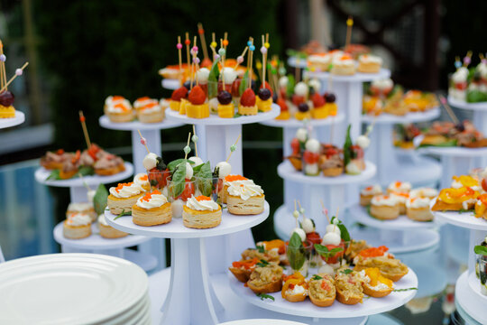 Vibrant fruit bites with herbs showcased outdoors for celebration
