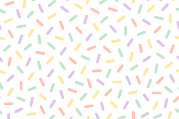 Fototapeta premium Colorful patterns of small shapes scattered on a white background during the daytime