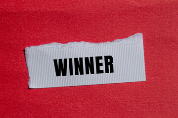 Winner message written on ripped torn paper background. Conceptual Winner symbol. Copy space.