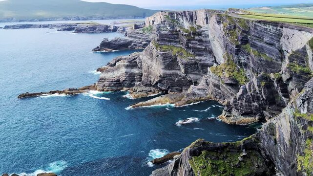 Kerry Cliffs and blue Atlantic Ocean on a sunny summer day, Portmagee, Ring of Kerry, Ireland	