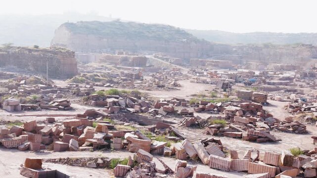 industrial stone mining area with exposed granite formations in Aravalli range