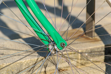 Detail of a Green Vintage Bicycle Fork and Wheel