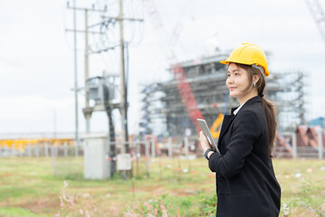 Asian female engineer representing a technology driven company at an industrial site, supporting business operations, engineering leadership, and effective machinery communication systems.