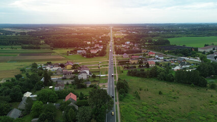 Aerial shot of straight road in countryside © AlexGo