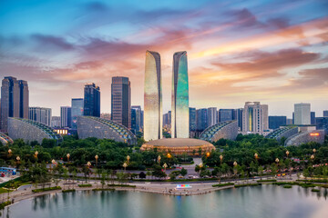 Fototapeta premium Modern City Skyline with Twin Towers at Sunset