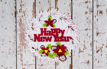 happy new year written on xmas background isolated on white wooden background