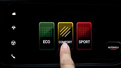Finger taps car touchscreen driving mode menu showing ECO COMFORT SPORT, offering choice between efficiency, comfort and sport.