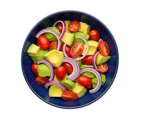 Fresh and healthy vegetable salad in a dark blue bowl, consisting of avocado cubes, whole cherry tomatoes, and red onion rings, isolated on a white background. Top view
