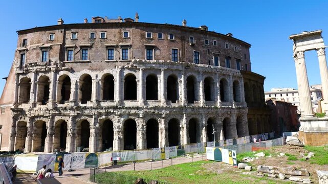 daytime teatro di marcello&rsquo;s multi arched fa&ccedil;ade corinthian columns temple apollo sosianus among ruins fencing under clear blue sky rome view empire multi-arched of 