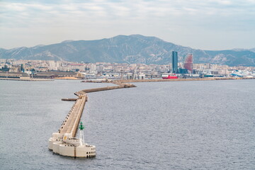 Port of Marseille. Long breakwater leading to the with green beacon, Marseille, France