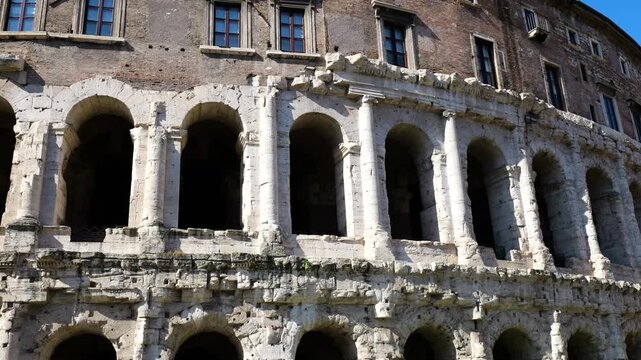 multi arched fa&ccedil;ade ancient theatre marcellus weathered stone columns deep shadowed archways renaissance palace rests atop historic structure rome italy of multi-arched 
