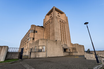 Low angle view of the imposing concrete Art Deco architecture of Radio Kootwijk, a former transmitter building on the Veluwe, Netherlands.