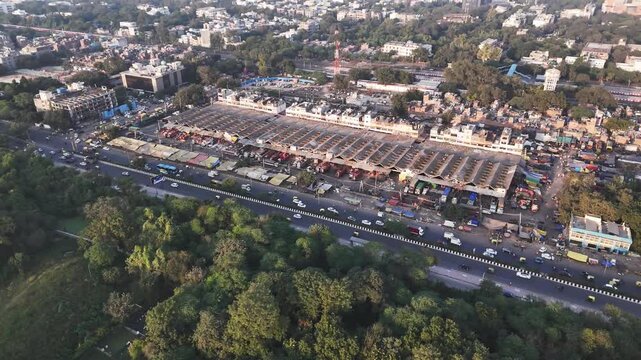 Aerial view of Okhla Mandi, South Delhi&rsquo;s bustling wholesale market, where rows of sheds, busy trucks, and nonstop activity highlight the city&rsquo;s vibrant trade and daily commerce ecosystem.