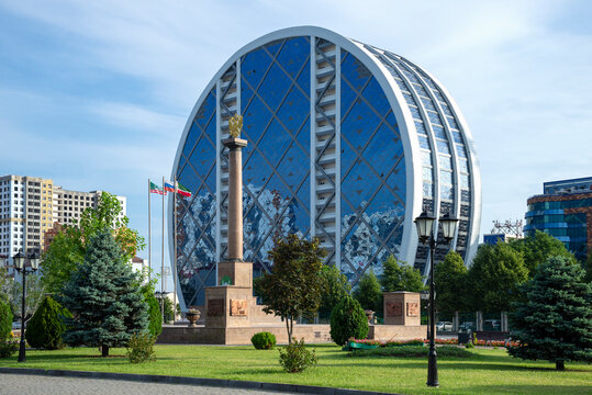 GROZNY, RUSSIA - JUNE 14, 2023: Stele "City of Military Glory" on the background of a modern building. Grozny, Chechen Republic