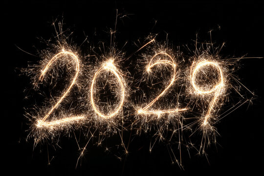 New year 2029 text formed from sparkler fireworks on black background