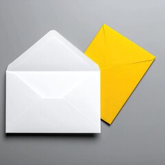 Two Envelopes, white and yellow, on a gray surface
