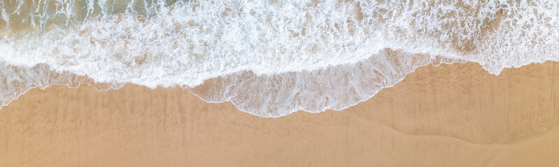 drone shot of a wave at the beach