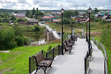 The alley leading to the pedestrian bridge over the Tura River. Verkhoturye, Sverdlovsk region, Russia