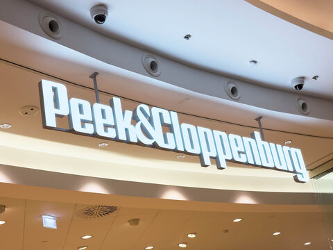 Zagreb, Croatia - December 17, 2025: Peek & Cloppenburg store sign illuminated in a modern shopping mall, showcasing contemporary retail design and branding elements