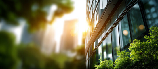 Sustainable green building eco friendly architecture heavily defocused background glass office building with trees reducing carbon dioxide green company office with environment