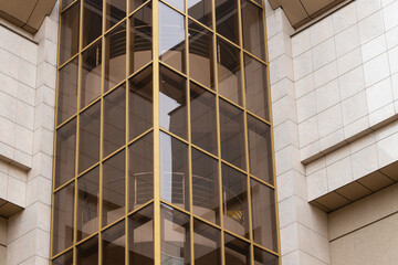 building landmark architecture exterior office building cement wall and glass window high rise object close up